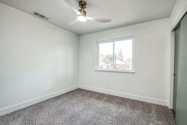 17367 Camden Dr, Madera, CA 93638 - unfurnished bedroom featuring baseboards, a closet, dark carpet, and ceiling fan