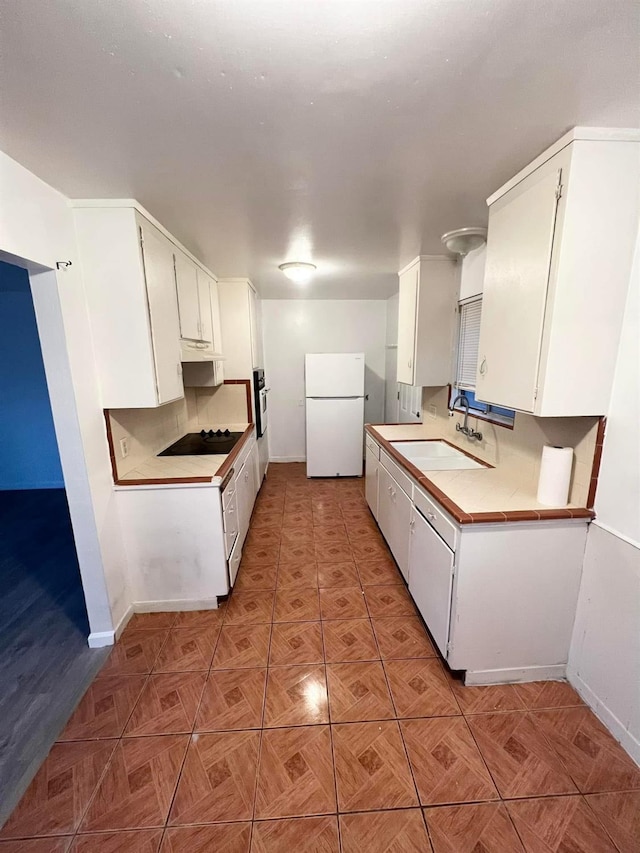 3127 E Mckenzie, Fresno, CA 93702 - kitchen featuring freestanding refrigerator, a sink, baseboards, wall oven, and light countertops