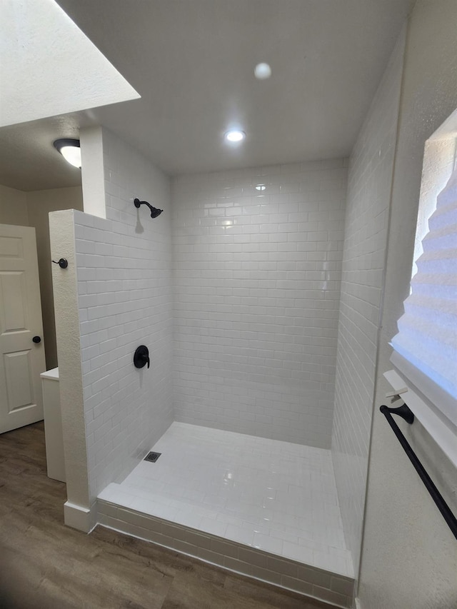 4754 E Andrews Ave, Fresno, CA 93726 - full bathroom featuring wood finished floors, tiled shower, and recessed lighting