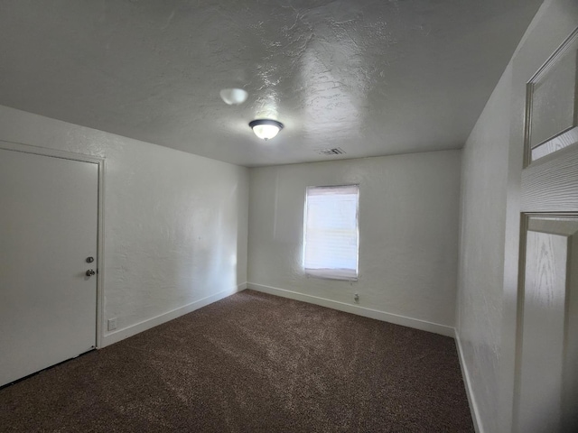 4754 E Andrews Ave, Fresno, CA 93726 - carpeted spare room with baseboards and a textured ceiling