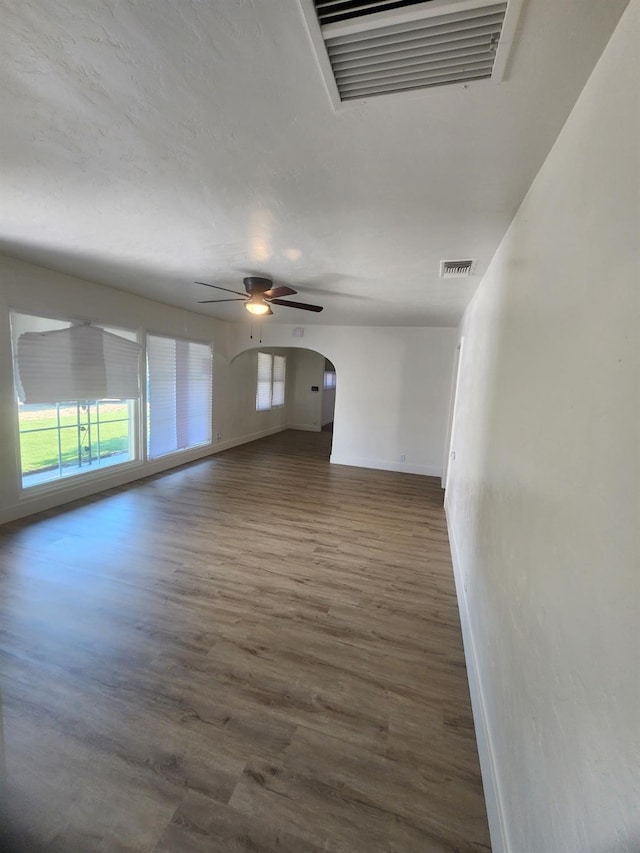 4754 E Andrews Ave, Fresno, CA 93726 - spare room featuring baseboards, arched walkways, wood finished floors, and ceiling fan
