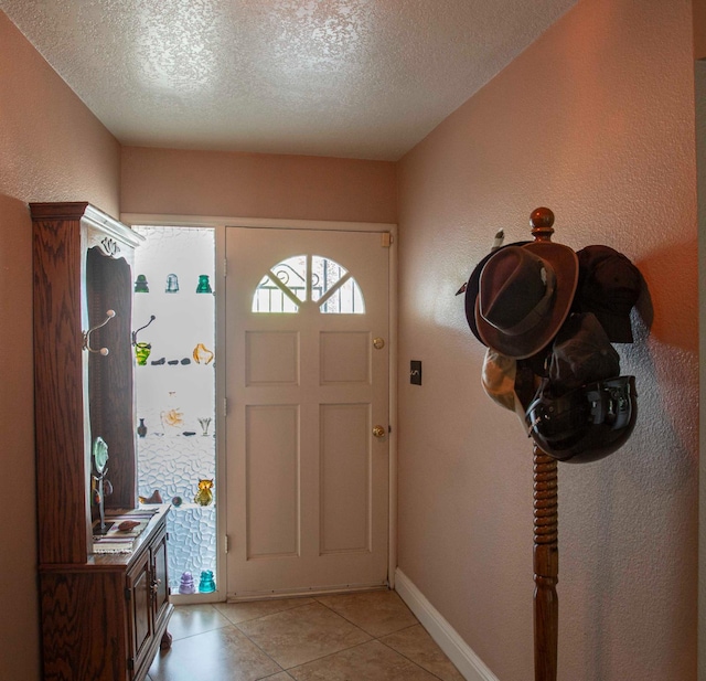 1720 W Barstow Ave, Fresno, CA 93711 - foyer entrance with a textured ceiling and light tile patterned floors