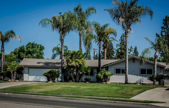 1720 W Barstow Ave, Fresno, CA 93711 - single story home with concrete driveway, a garage, and a front lawn