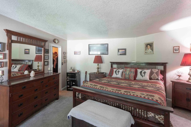 1720 W Barstow Ave, Fresno, CA 93711 - bedroom featuring carpet flooring, a textured ceiling, and a walk in closet