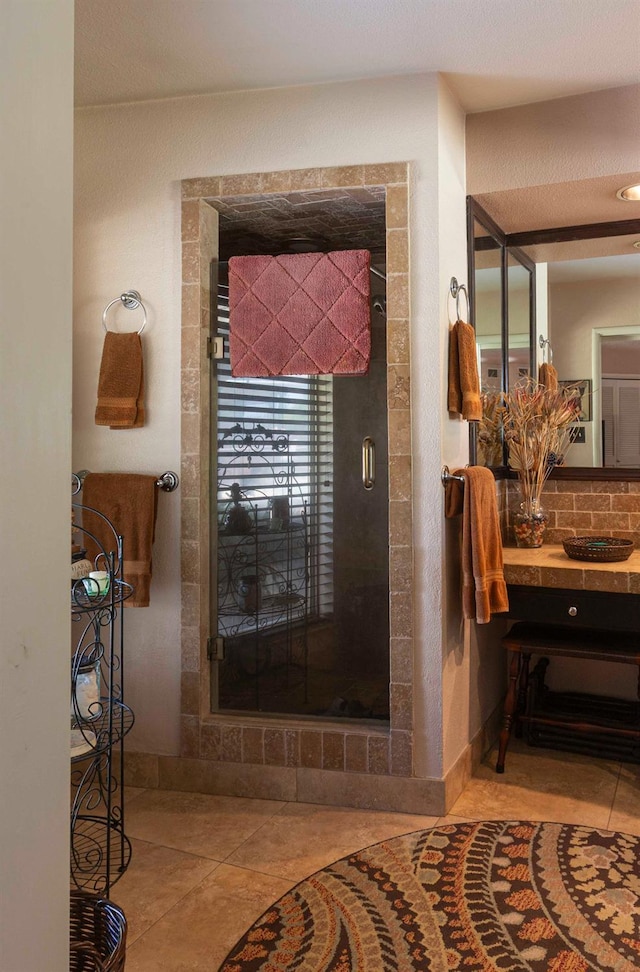 1720 W Barstow Ave, Fresno, CA 93711 - bathroom with tile patterned flooring, vanity, and a shower stall