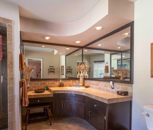 1720 W Barstow Ave, Fresno, CA 93711 - bathroom featuring backsplash, vanity, recessed lighting, toilet, and tile patterned flooring