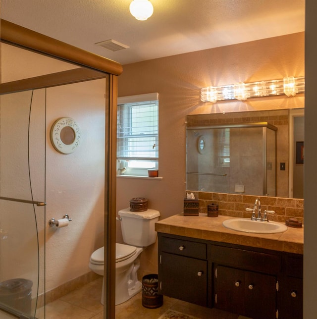 1720 W Barstow Ave, Fresno, CA 93711 - bathroom with toilet, vanity, a shower stall, and tile patterned flooring