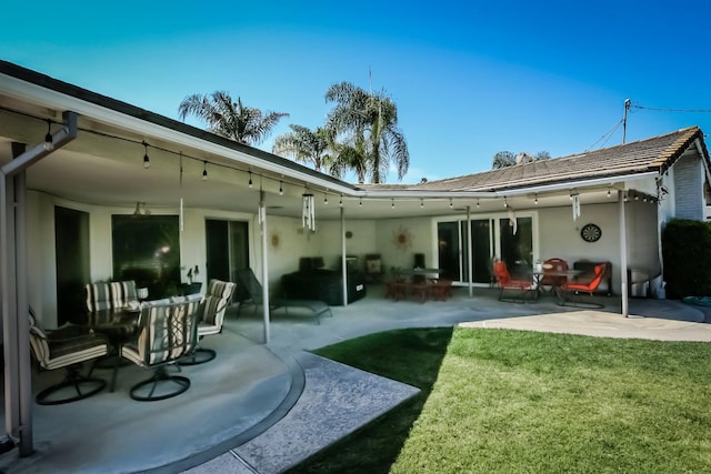 1720 W Barstow Ave, Fresno, CA 93711 - rear view of house featuring a lawn, a patio, and stucco siding