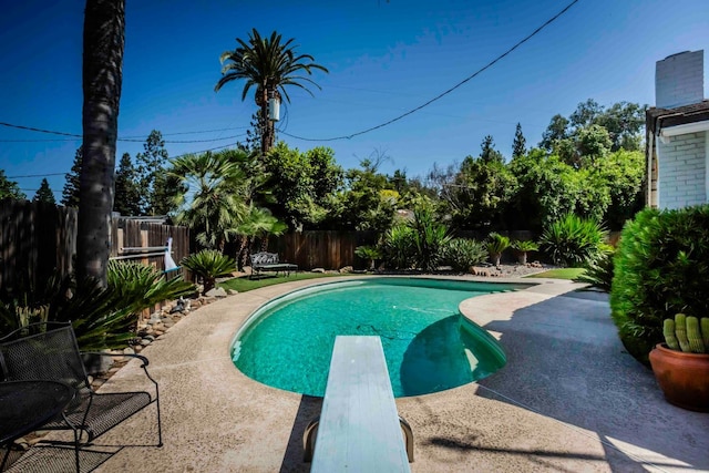 1720 W Barstow Ave, Fresno, CA 93711 - view of swimming pool with a diving board, a fenced backyard, and a patio area