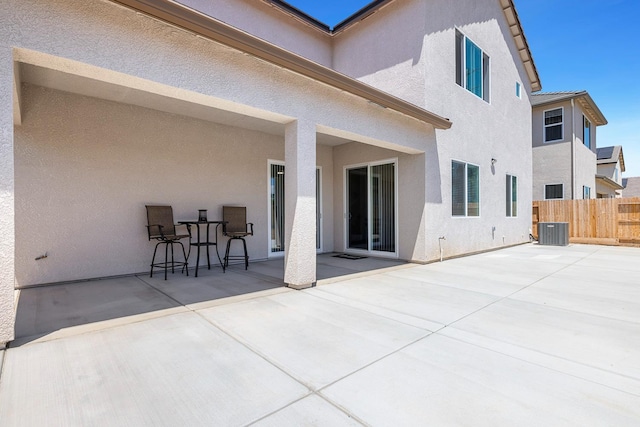 2054 N Laverne Ave, Fresno, CA 93727 - rear view of house with central AC unit, a patio area, stucco siding, and a tiled roof