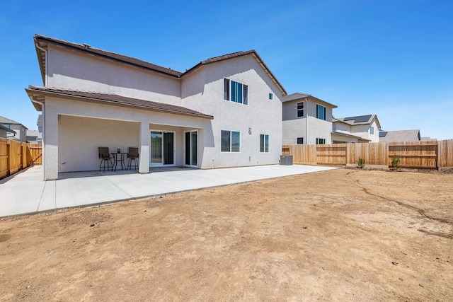 2054 N Laverne Ave, Fresno, CA 93727 - rear view of property featuring a patio, a fenced backyard, and stucco siding