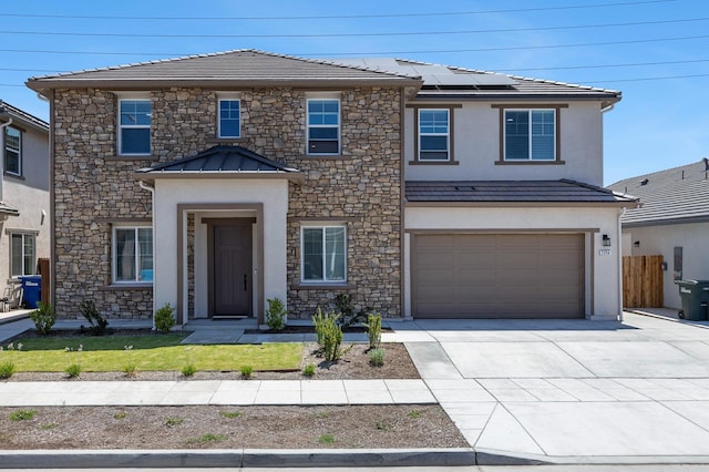 2054 N Laverne Ave, Fresno, CA 93727 - traditional-style house featuring concrete driveway, stone siding, solar panels, and stucco siding
