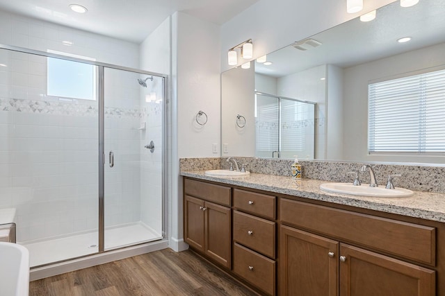 2054 N Laverne Ave, Fresno, CA 93727 - full bath with wood finished floors, a stall shower, and double vanity