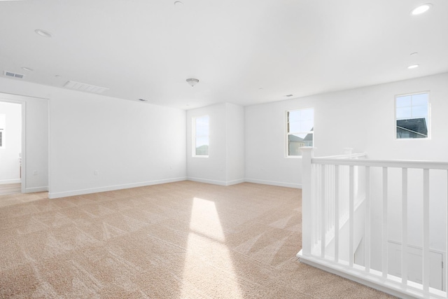 2054 N Laverne Ave, Fresno, CA 93727 - empty room featuring light carpet, baseboards, and recessed lighting