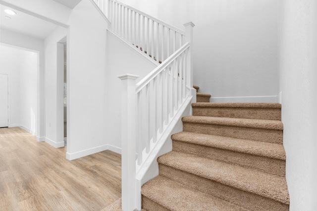 2054 N Laverne Ave, Fresno, CA 93727 - staircase with baseboards, wood finished floors, and recessed lighting