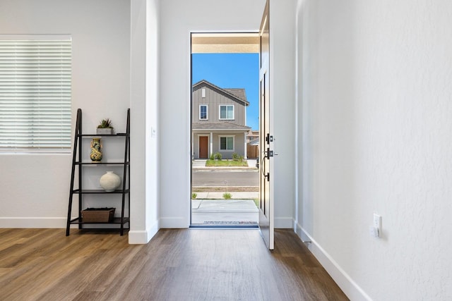 2054 N Laverne Ave, Fresno, CA 93727 - doorway to outside featuring wood finished floors and baseboards