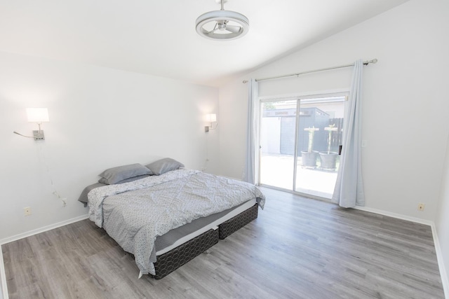 6412 E Inyo St, Fresno, CA 93727 - bedroom featuring lofted ceiling, access to outside, wood finished floors, and baseboards