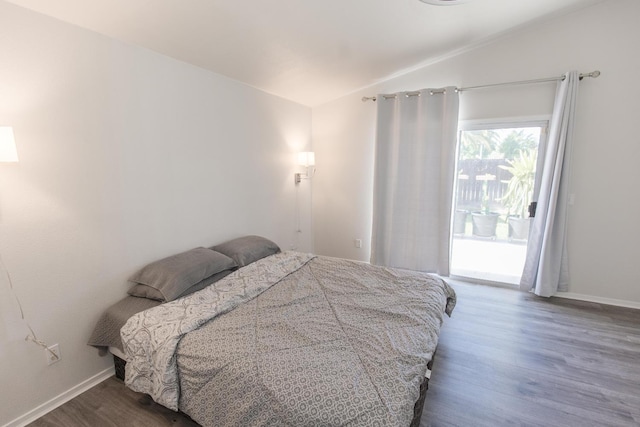 6412 E Inyo St, Fresno, CA 93727 - bedroom featuring lofted ceiling, access to exterior, dark wood-style flooring, and baseboards