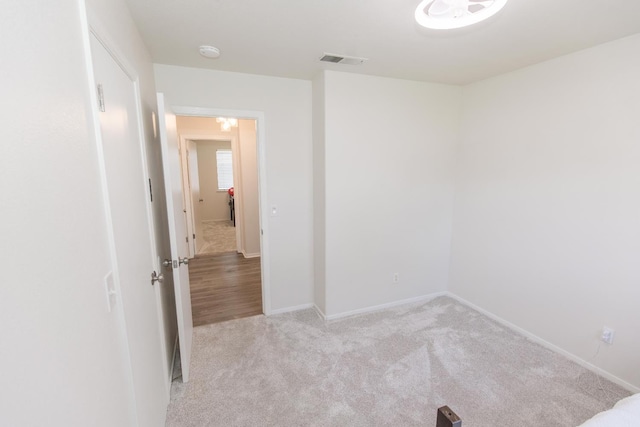 6412 E Inyo St, Fresno, CA 93727 - empty room featuring light carpet, a smoke detector, and baseboards