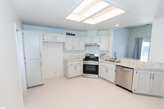 6412 E Inyo St, Fresno, CA 93727 - kitchen featuring appliances with stainless steel finishes, under cabinet range hood, a sink, white cabinetry, and light flooring