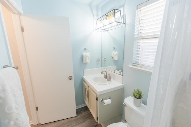 6412 E Inyo St, Fresno, CA 93727 - bathroom with vanity, toilet, and wood finished floors