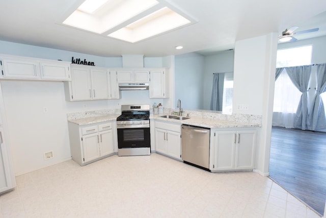 6412 E Inyo St, Fresno, CA 93727 - kitchen with stainless steel appliances, a sink, healthy amount of natural light, and under cabinet range hood