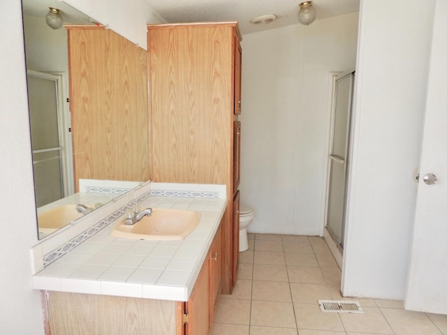 15716 S Hughes, Caruthers, CA 93609 - full bathroom featuring vanity, a stall shower, and tile patterned flooring