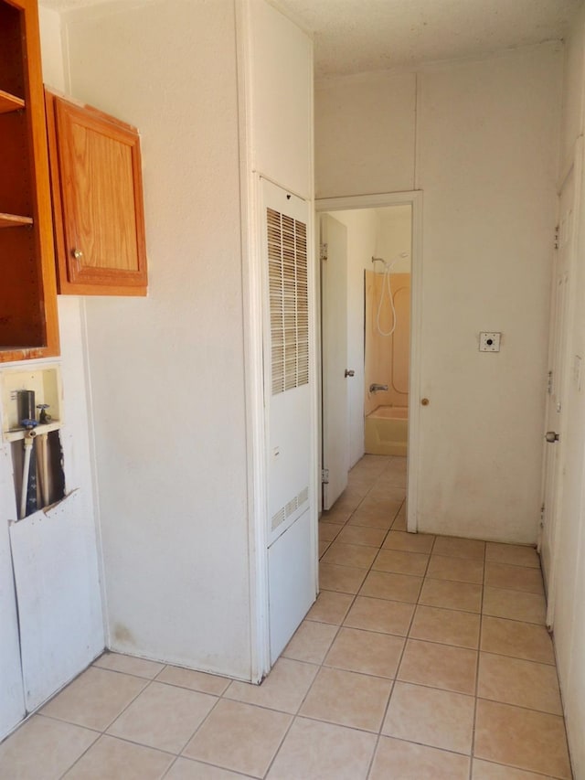 15716 S Hughes, Caruthers, CA 93609 - corridor featuring a heating unit and light tile patterned floors