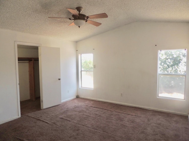 15716 S Hughes, Caruthers, CA 93609 - unfurnished bedroom with carpet flooring, lofted ceiling, a textured ceiling, a spacious closet, and ceiling fan