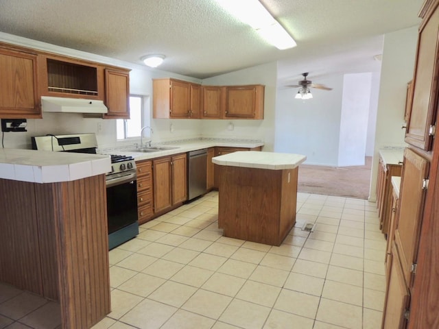 15716 S Hughes, Caruthers, CA 93609 - kitchen featuring appliances with stainless steel finishes, under cabinet range hood, a center island, ceiling fan, and light tile patterned floors