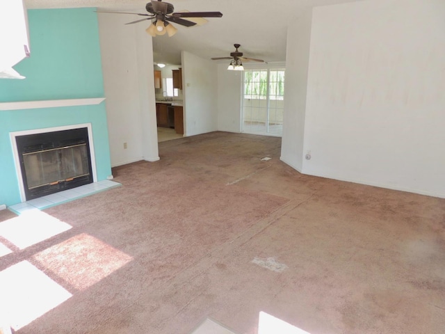 15716 S Hughes, Caruthers, CA 93609 - unfurnished living room with carpet flooring, ceiling fan, and a glass covered fireplace