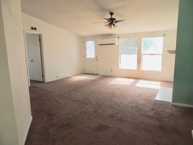 15716 S Hughes, Caruthers, CA 93609 - carpeted spare room with a wall mounted AC, a ceiling fan, and a textured ceiling