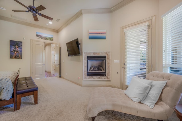 2136 E Royal Dornoch Ave, Fresno, CA 93730 - living area with ornamental molding, ceiling fan, a glass covered fireplace, carpet floors, and baseboards
