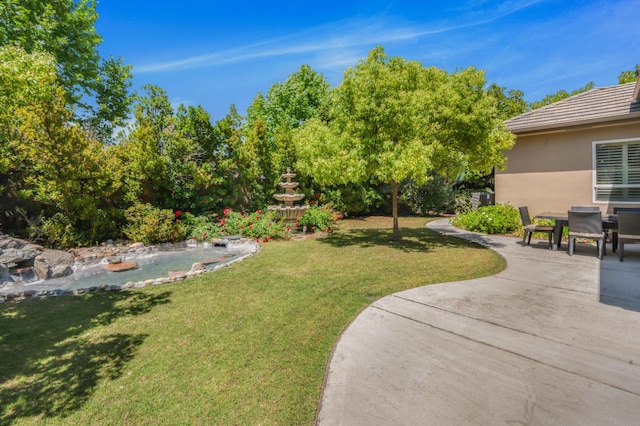 2136 E Royal Dornoch Ave, Fresno, CA 93730 - view of grassy yard featuring a patio area