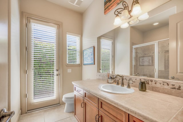2136 E Royal Dornoch Ave, Fresno, CA 93730 - full bath with toilet, tile patterned flooring, vanity, and a shower stall