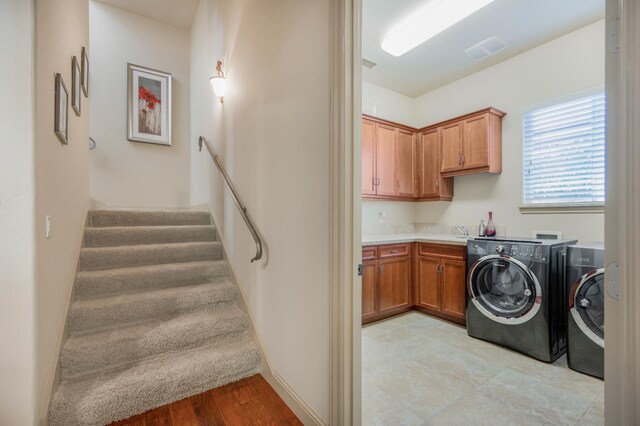 2136 E Royal Dornoch Ave, Fresno, CA 93730 - laundry area featuring cabinet space and washing machine and clothes dryer
