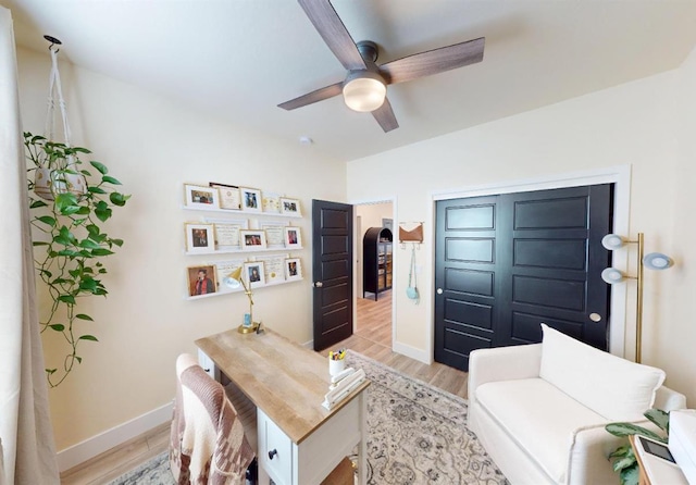 2897 E Tamarind Dr, Fresno, CA 93730 - office with light wood-type flooring, a ceiling fan, and baseboards