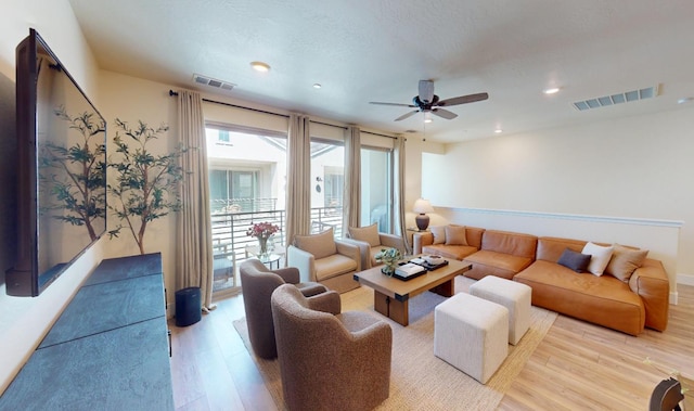 2897 E Tamarind Dr, Fresno, CA 93730 - living room with light wood-style floors, ceiling fan, and recessed lighting