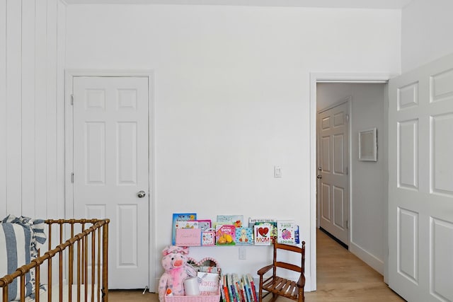 1985 Alma Ct, Chowchilla, CA 93610 - bedroom with light wood finished floors and a crib