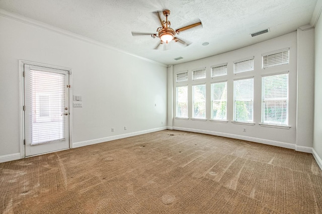1251 E Rosemont Ln, Fresno, CA 93730 - carpeted empty room with ceiling fan, baseboards, crown molding, and a textured ceiling