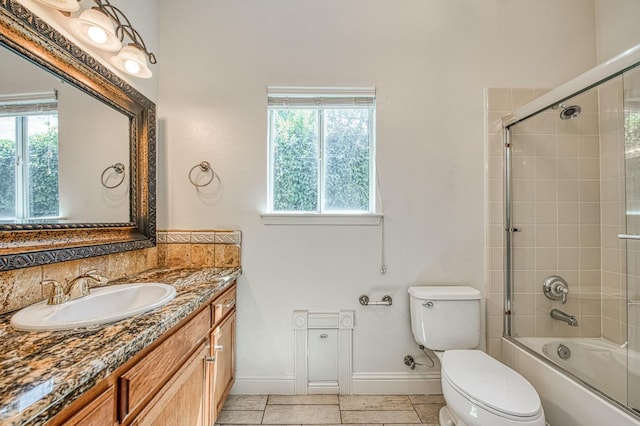 1251 E Rosemont Ln, Fresno, CA 93730 - bathroom with toilet, baseboards, vanity, and healthy amount of natural light