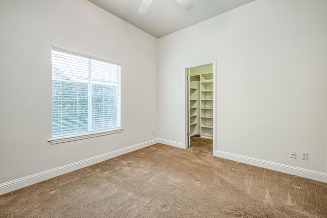 1251 E Rosemont Ln, Fresno, CA 93730 - spare room with carpet flooring, baseboards, and ceiling fan