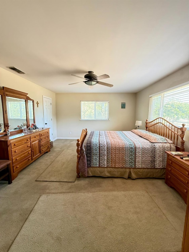 31117 Longview Ln E, Coarsegold, CA 93614 - bedroom featuring light colored carpet, multiple windows, and ceiling fan