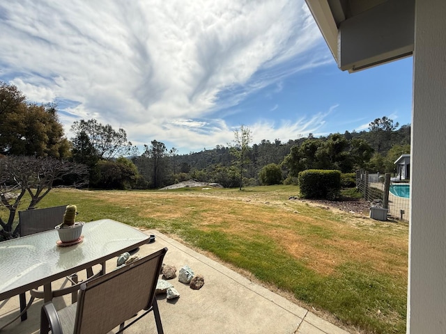 31117 Longview Ln E, Coarsegold, CA 93614 - view of green lawn with a patio area and outdoor dining space