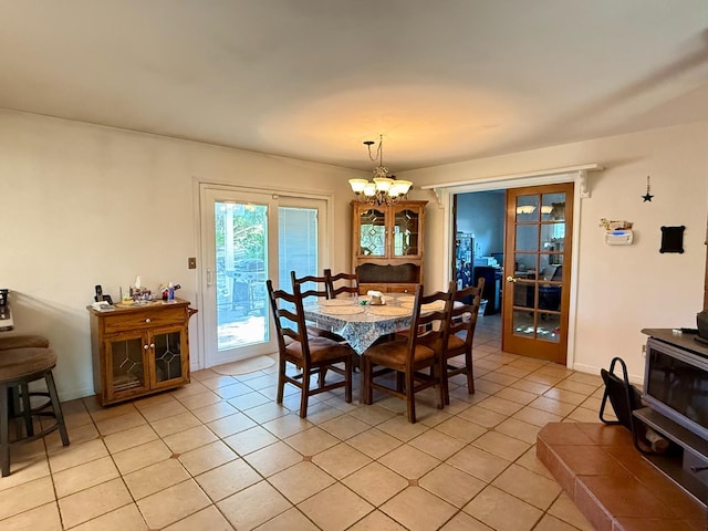 31117 Longview Ln E, Coarsegold, CA 93614 - dining space with light tile patterned flooring, a chandelier, and french doors
