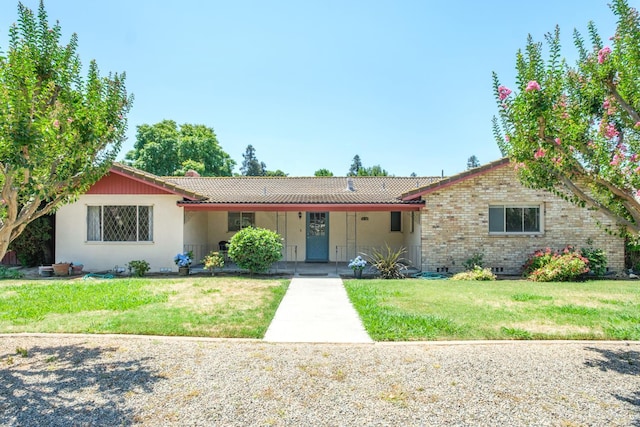 1438 E Rialto Ave, Fresno, CA 93704 - ranch-style house with a front yard, brick siding, crawl space, and stucco siding