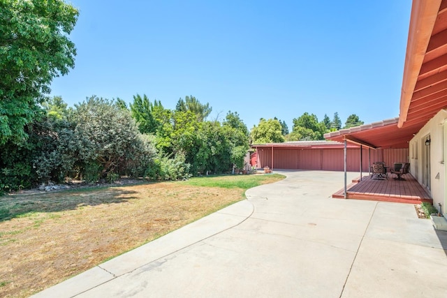 1438 E Rialto Ave, Fresno, CA 93704 - view of grassy yard with a patio area and a wooden deck