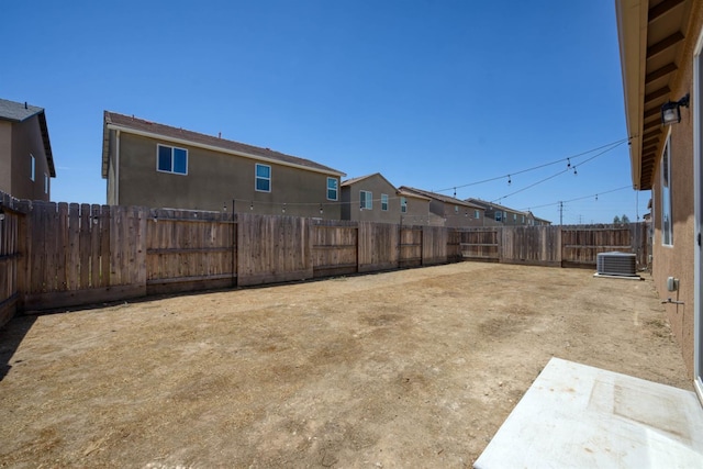 6659 E Vassar Ave, Fresno, CA 93727 - fenced backyard with central air condition unit and a residential view