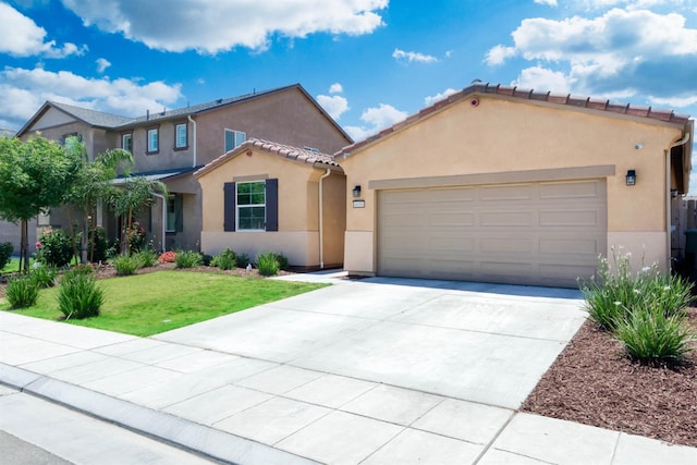 6659 E Vassar Ave, Fresno, CA 93727 - mediterranean / spanish-style house with stucco siding, driveway, an attached garage, a front lawn, and a tile roof