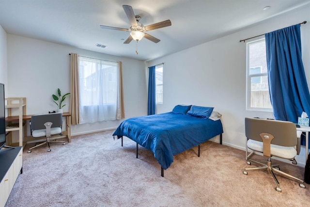 6659 E Vassar Ave, Fresno, CA 93727 - bedroom featuring multiple windows, carpet, baseboards, and ceiling fan